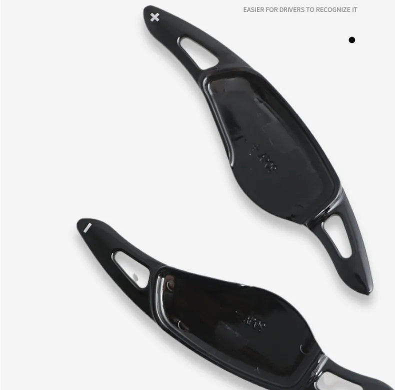 Carbon fibre pattern steering wheel paddle shifters in black and red finishes