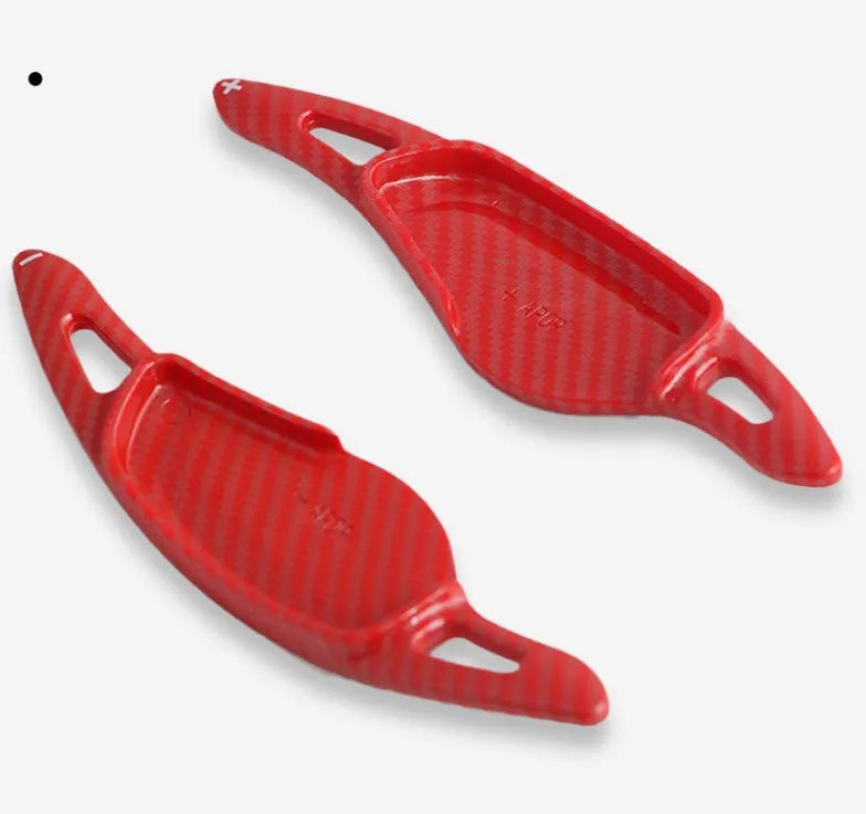 Carbon fibre pattern steering wheel paddle shifters in black and red finishes