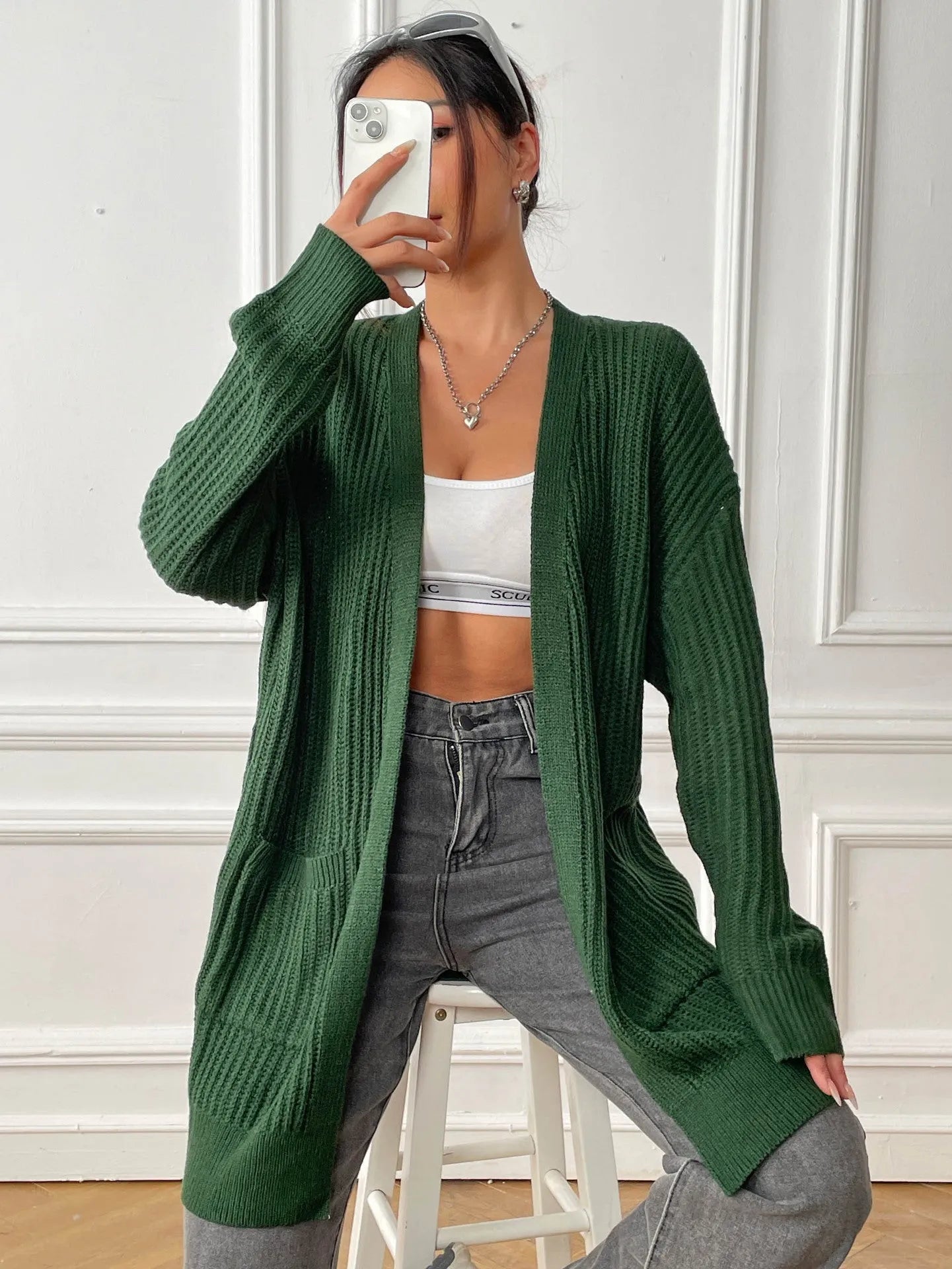 Women's loose fit acrylic cardigan with double pockets in dark green colour