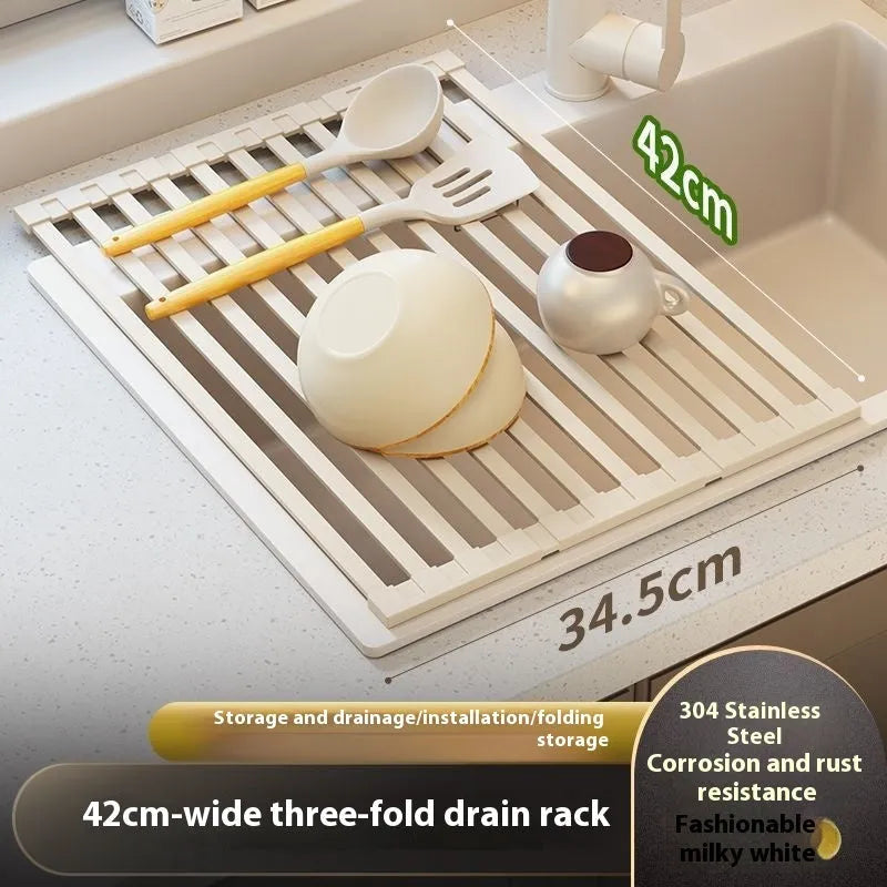 Milky white foldable stainless steel kitchen draining rack shown in a sink.