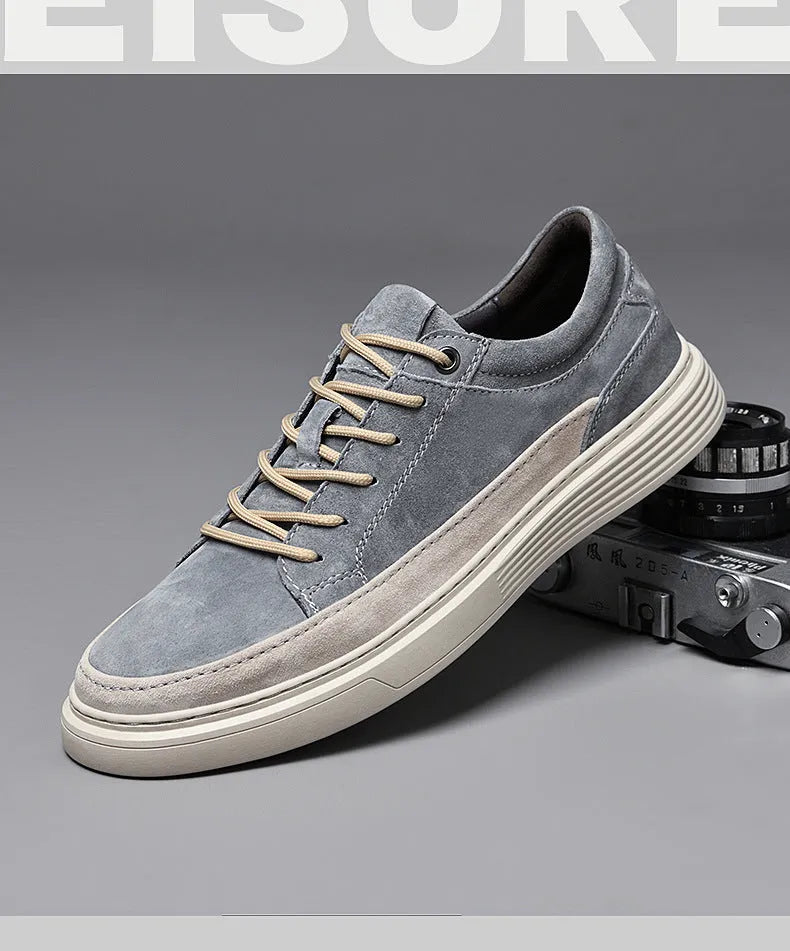 Men's grey pigskin leather casual skate shoes with flat rubber sole and lace-up front.