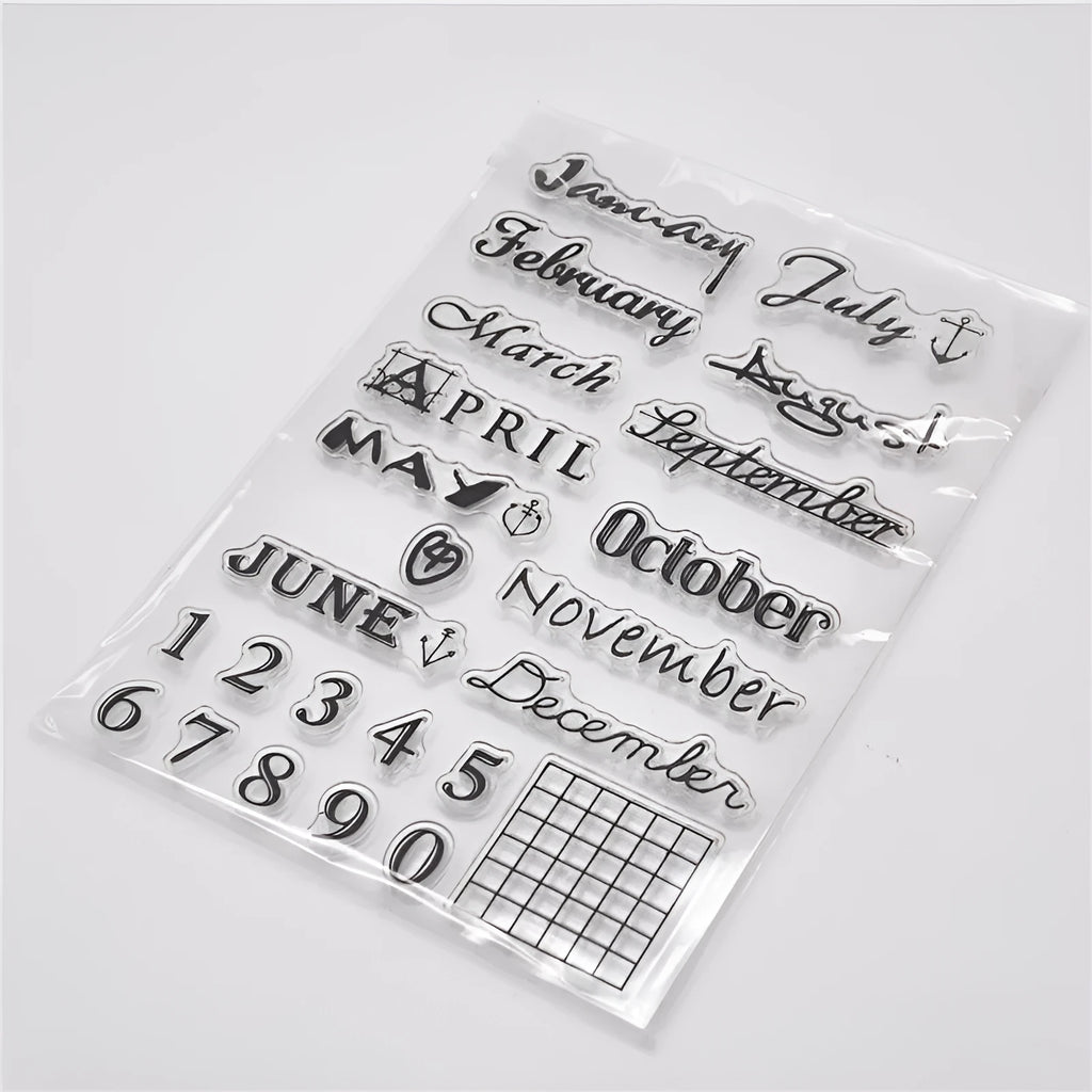 Close-up of a transparent silicone craft stamp featuring vintage-style calendar icons on a digital table background.
