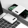 Black and white portable power bank with multi-USB ports showing 10000mAh capacity label