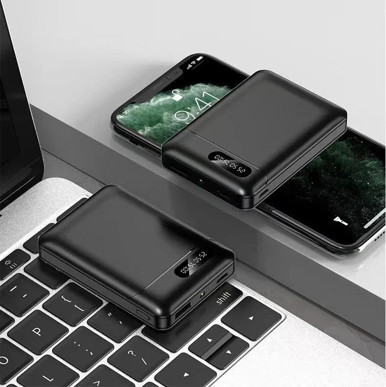 Black and white portable power bank with multi-USB ports showing 10000mAh capacity label