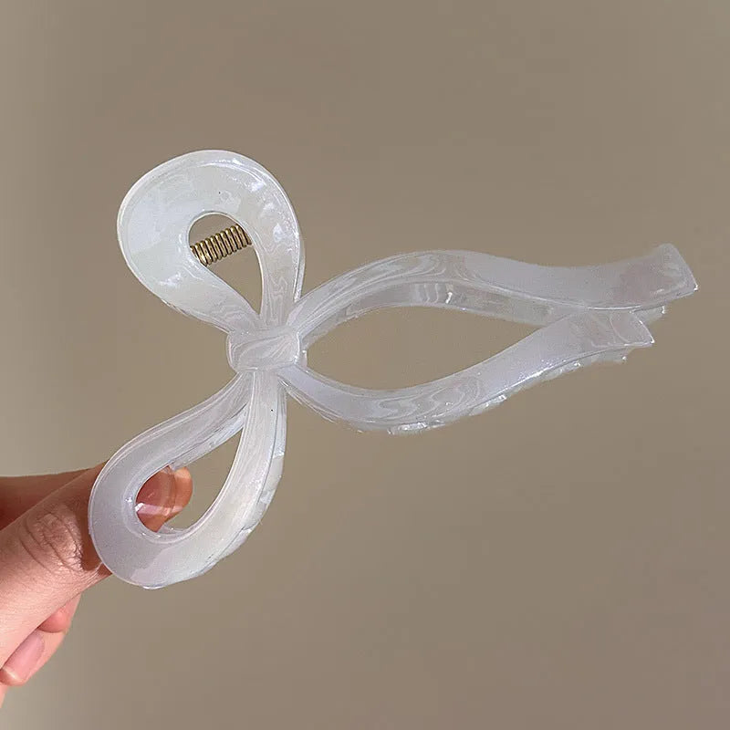 Women's ice bowknot resin hair clip with sweet bow design in blue, pink, and white colour options