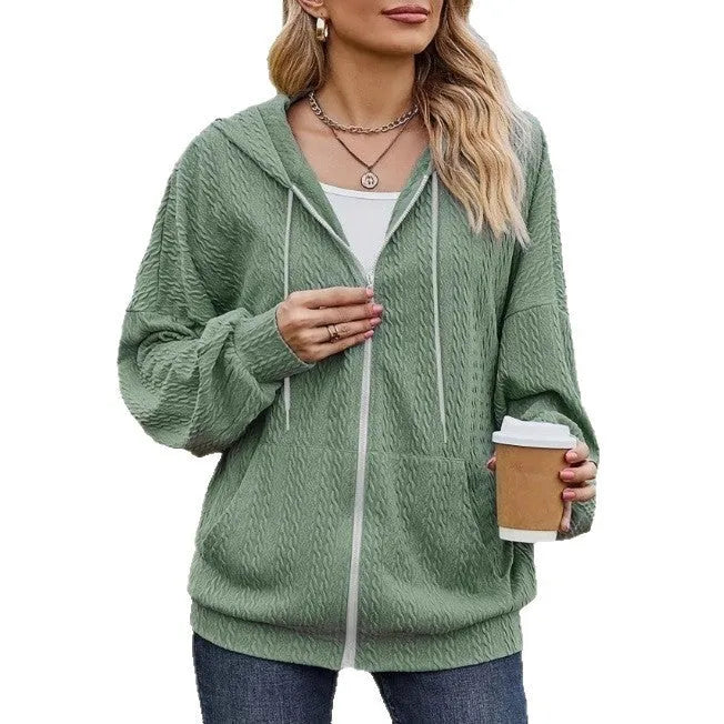 Green loose fit hooded zipper coat for women on a hanger.