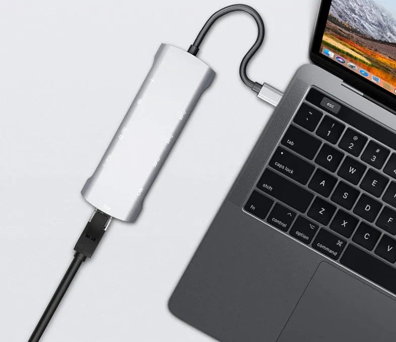 Grey aluminium USB-C docking station with HDMI, VGA, and USB 3.0 ports