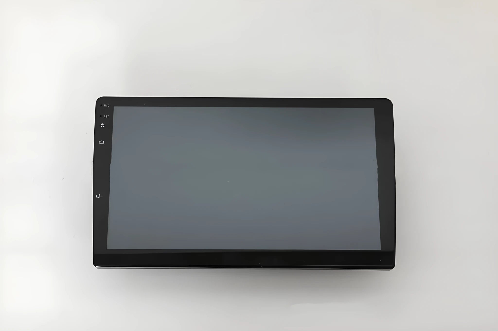 10.1 inch Android car head unit with touch screen, trapezoid panel design and universal fitting for vehicle dashboards