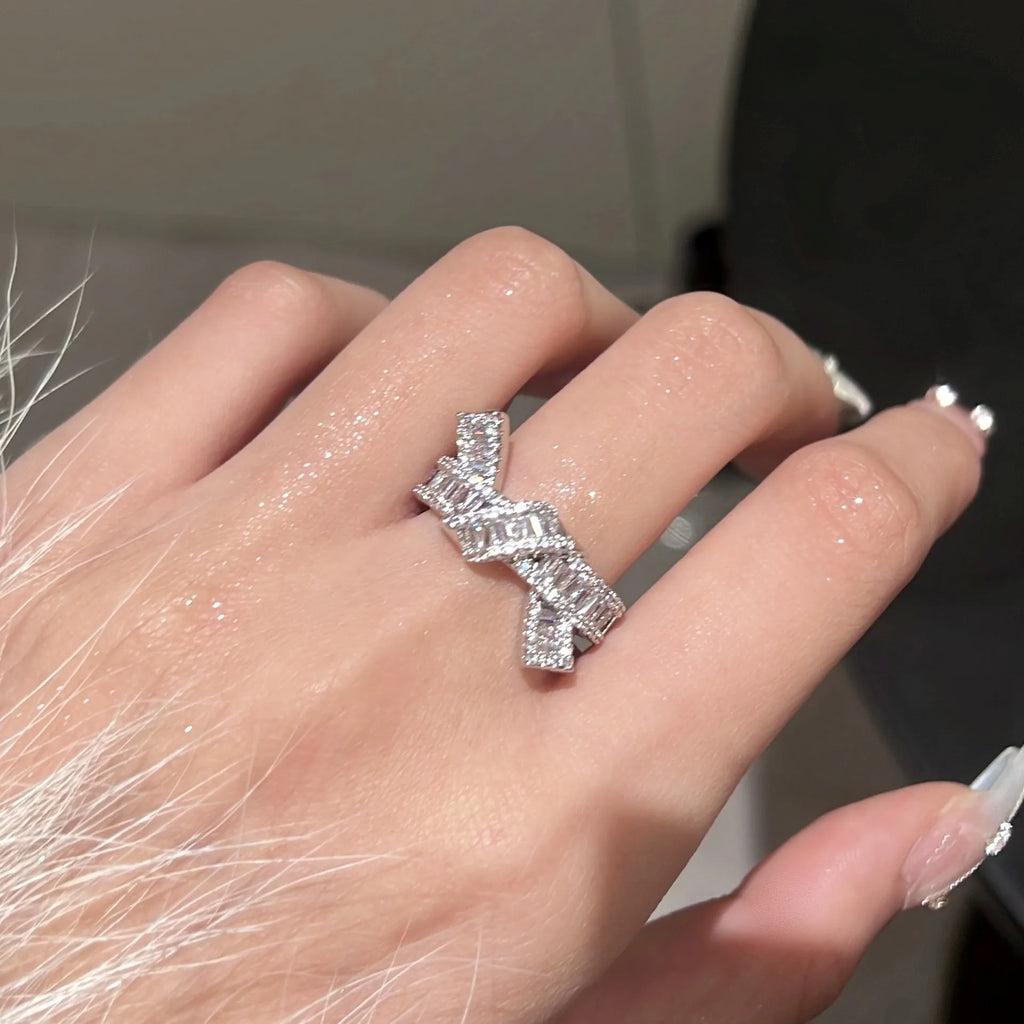 Silver cross open ring with bow shape, copper base with electroplated finish, minimalist light luxury style