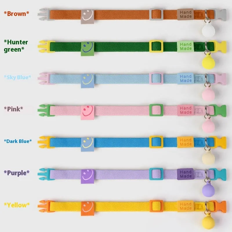 Solid colour elastic polyester dog collar for small breeds, shown in various colours on a white background.