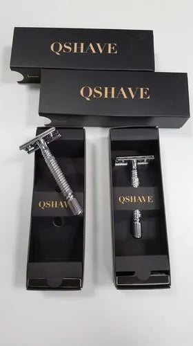 Double edged safety razor with chrome-plated brass handle and stainless steel head in storage box