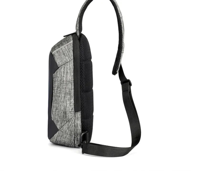 Small dark blue Oxford cloth chest bag with zipper closure showing internal phone compartment