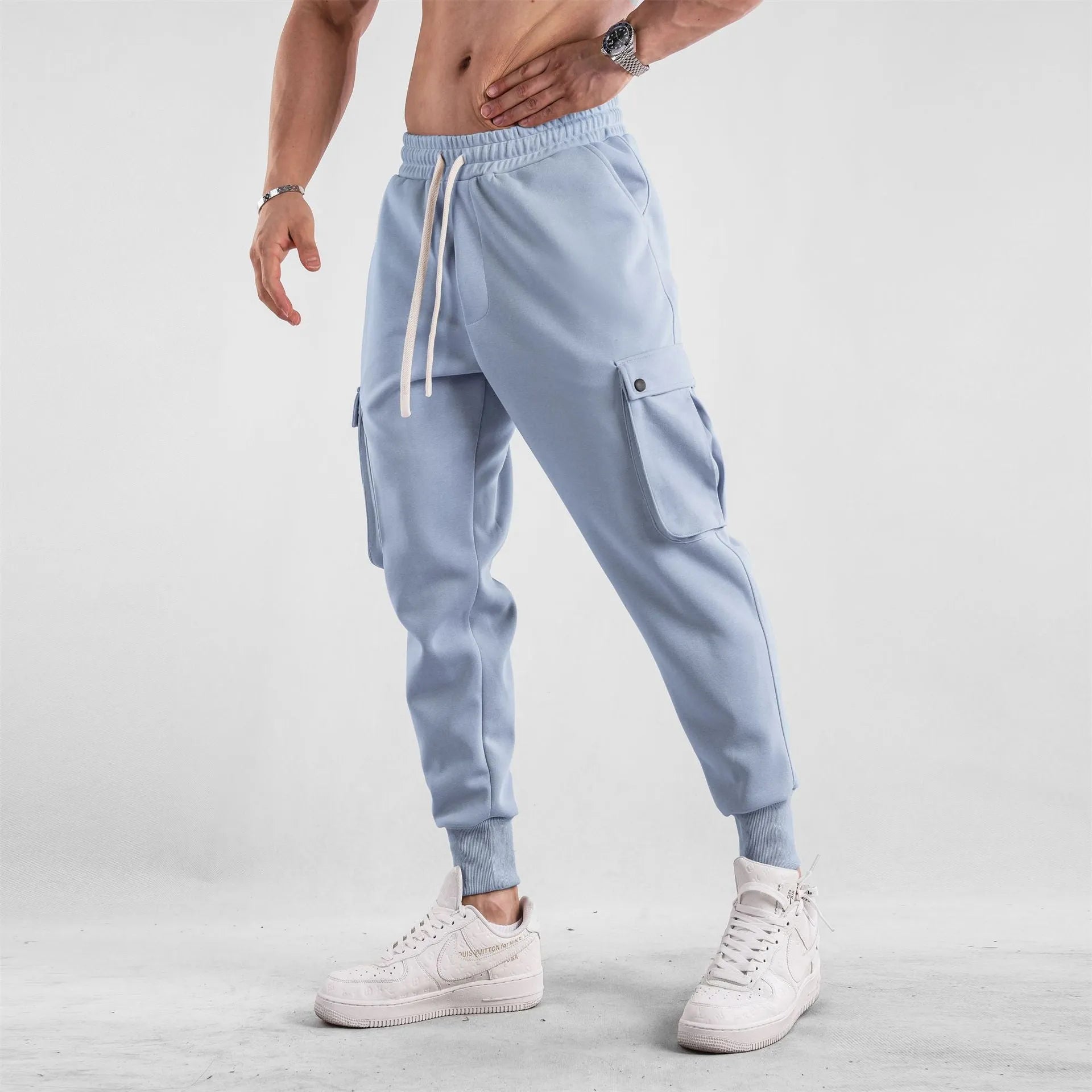 Men's cotton sports trousers with ankle ties and multiple pockets in apricot colour