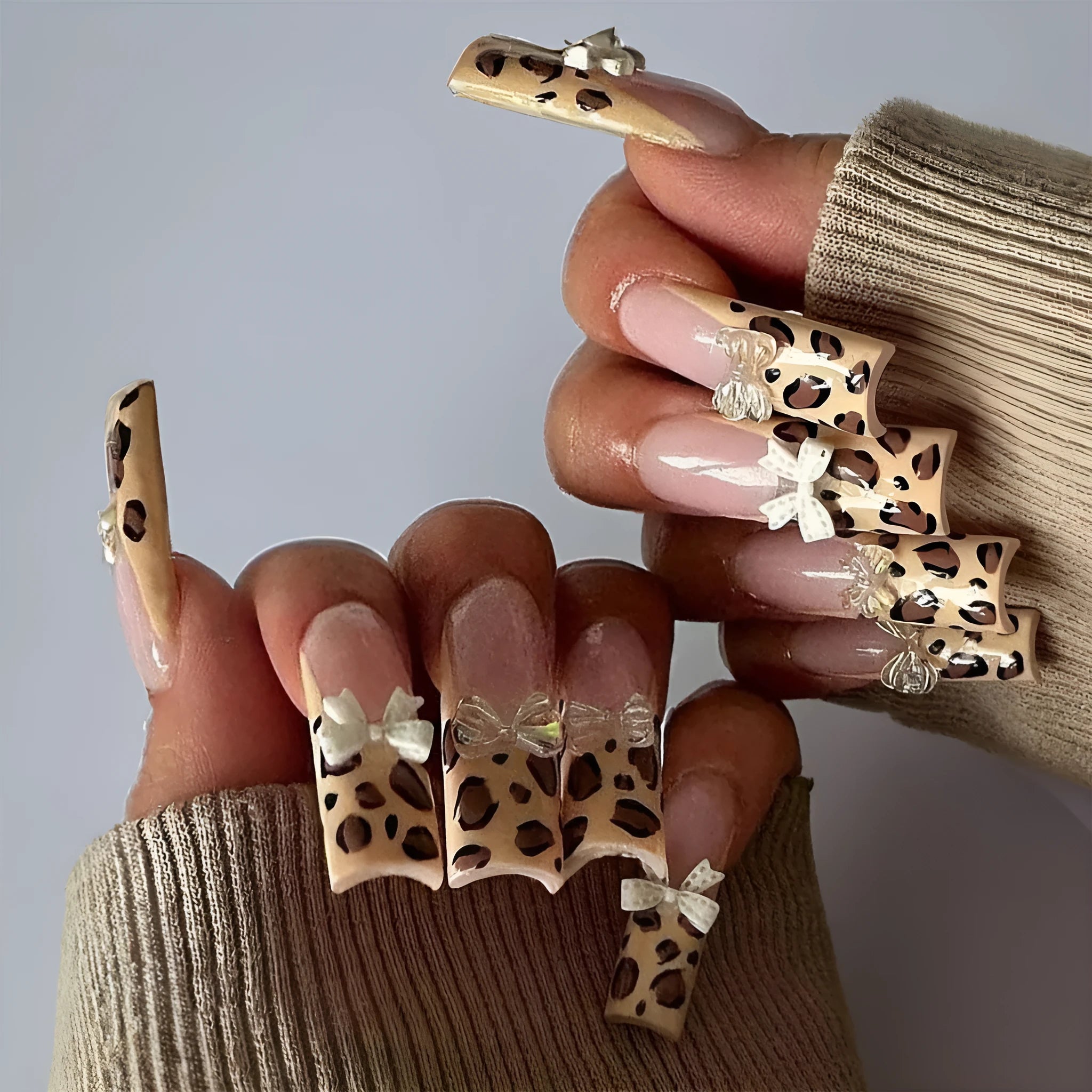 Leopard print false nail set with butterfly designs in WM296 colour