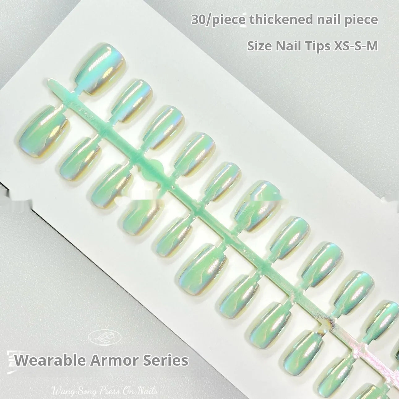 Electroplated Cat's Eye artificial nail art set in short ladder lengths XS, S, and M on display.