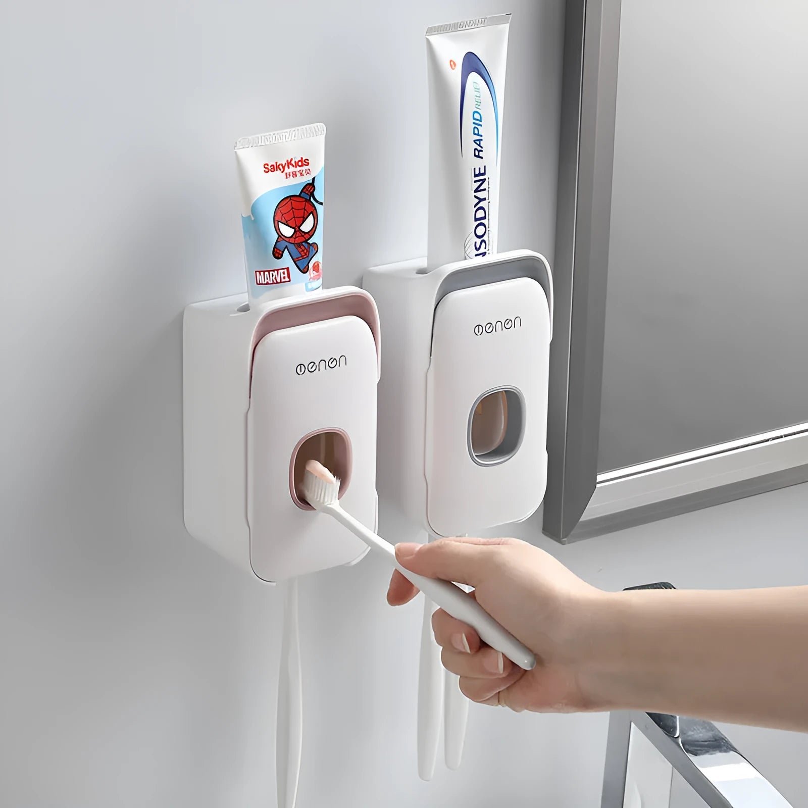 Automatic toothpaste dispenser in blue colour made from ABS plastic with a wall-mount design.