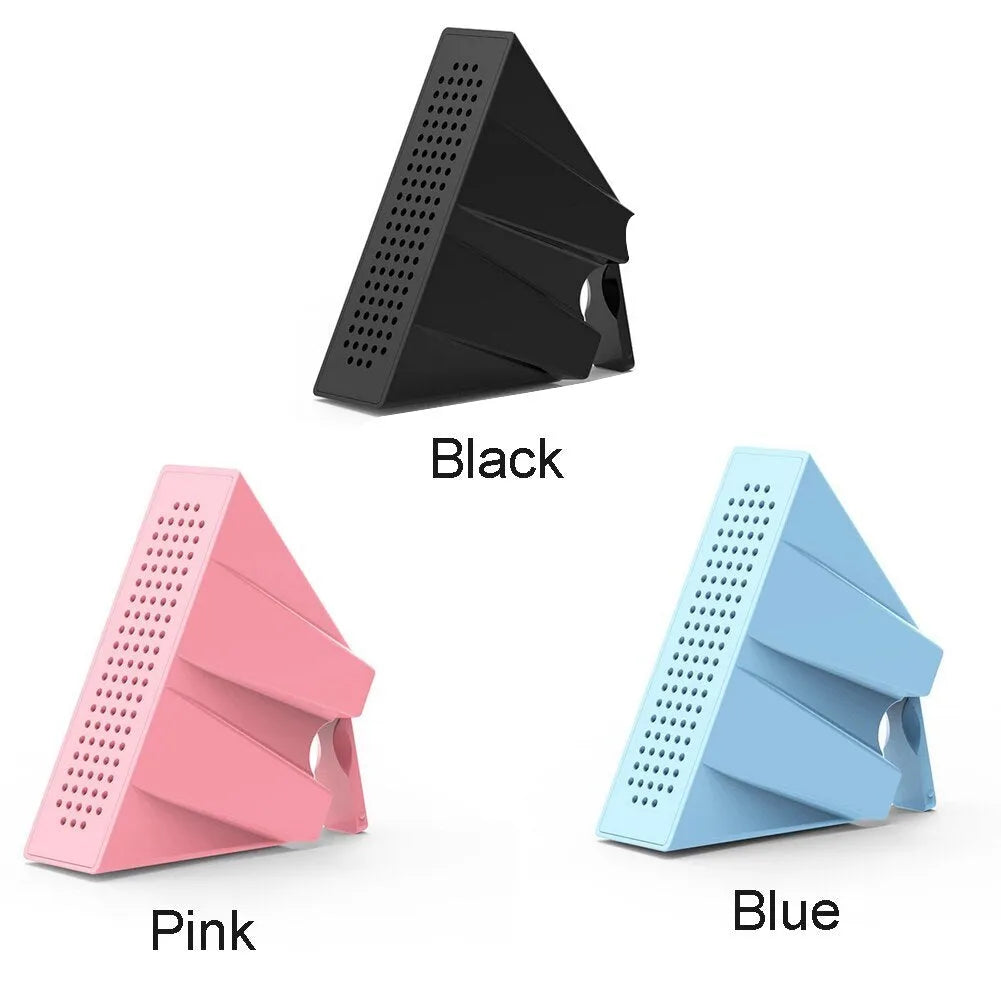Portable black ABS mobile phone amplifier bracket holding an iPhone on a desk.