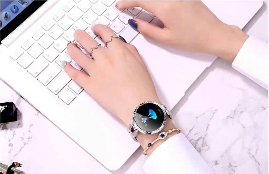 Rose gold women's smart watch with round dial, stainless steel strap, and 1.08-inch HD screen