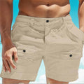 Men's khaki linen shorts with an elastic waistband and button pockets laid flat