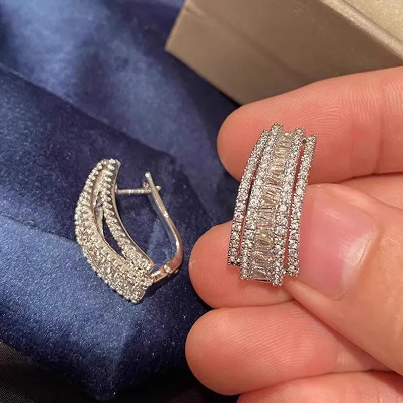 Geometric zircon stud earrings in white gold colour with copper construction