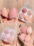 Four synthetic sponge makeup egg applicators in Grape, Mango, Mint, and Peach peach colours.
