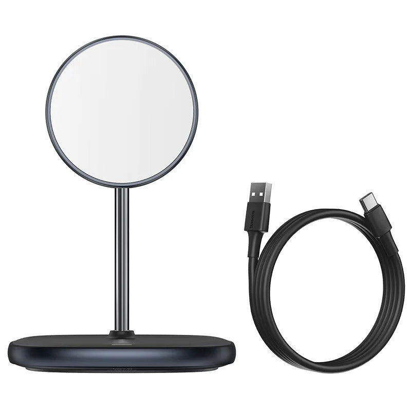 Black magnetic wireless charging stand holding an iPhone 12 Pro on a desk.