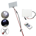 LED fishing rod light with telescopic pole extended, showing remote control and 12V power connection