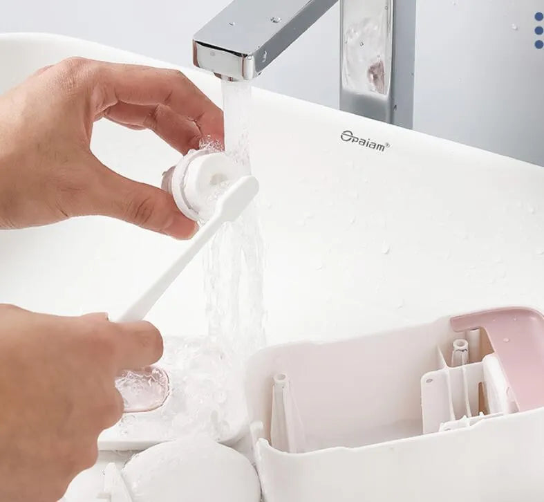 Automatic toothpaste dispenser in blue colour made from ABS plastic with a wall-mount design.