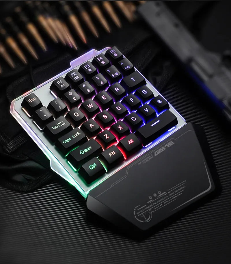 Black robotic one-handed mechanical keyboard with RGB backlit keys on a G40 flow colour plate.