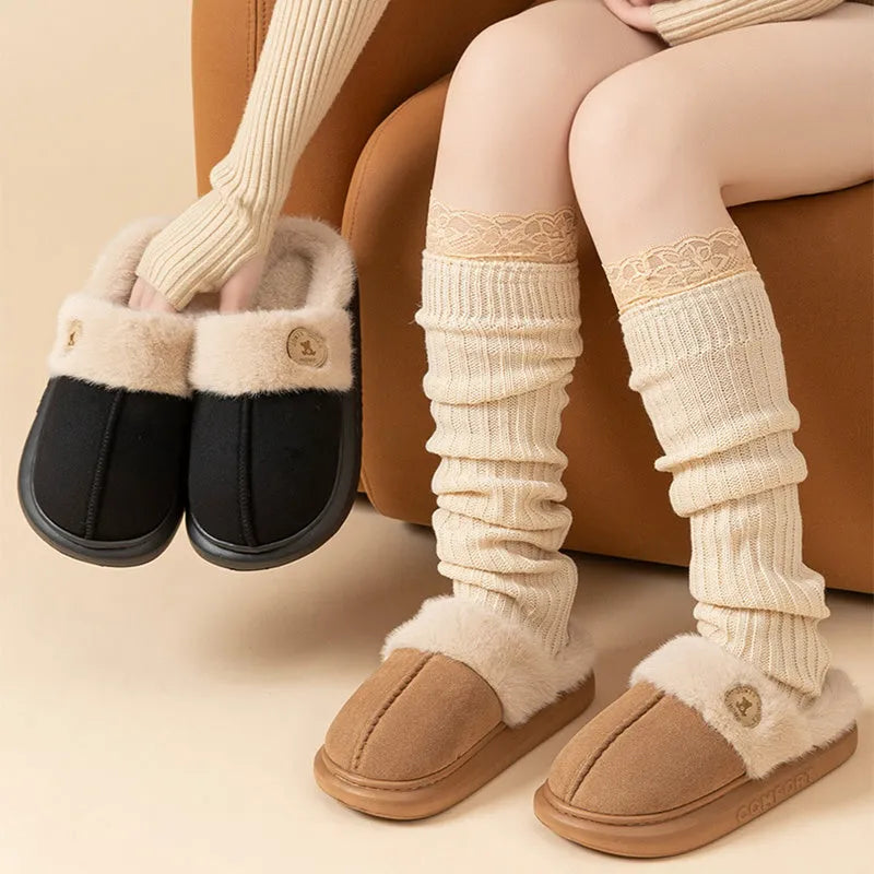 Pair of thick-soled fleece slippers in multiple colour options on a white background.