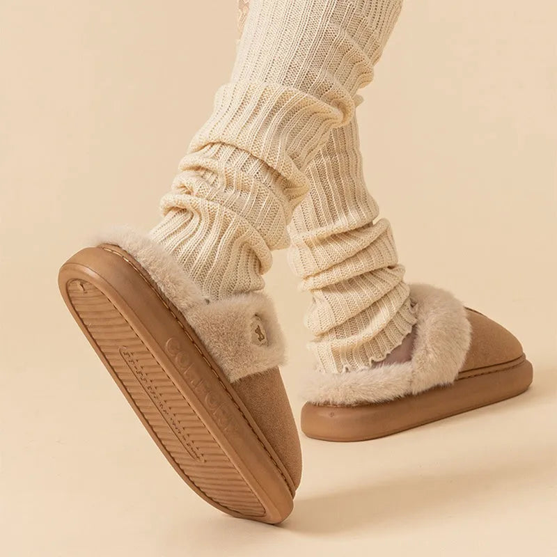 Pair of thick-soled fleece slippers in multiple colour options on a white background.