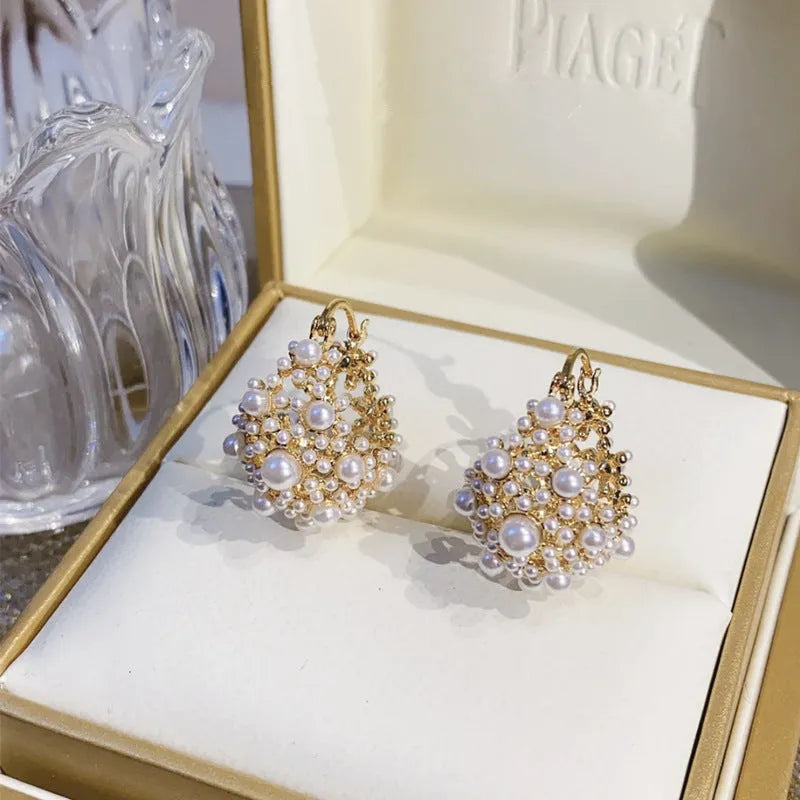 Gold copper flower basket earrings for women with pearl inlay and small bead details