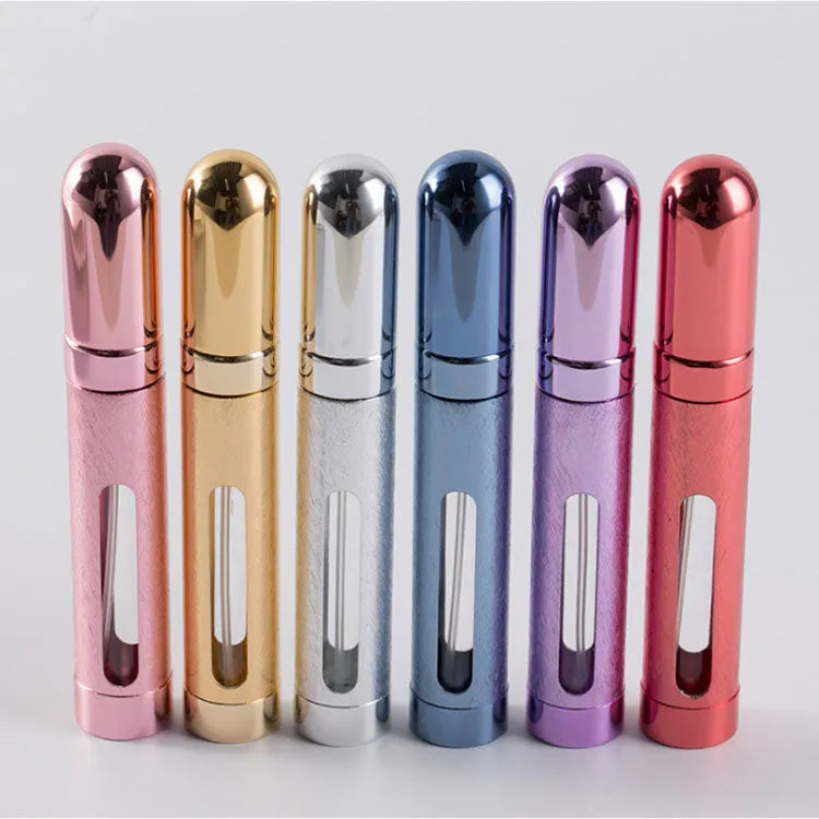 A slim, portable 12ml aluminium perfume bottle with a glass liner in choice of colours including blue, golden, pink, red, silvery, and violet.