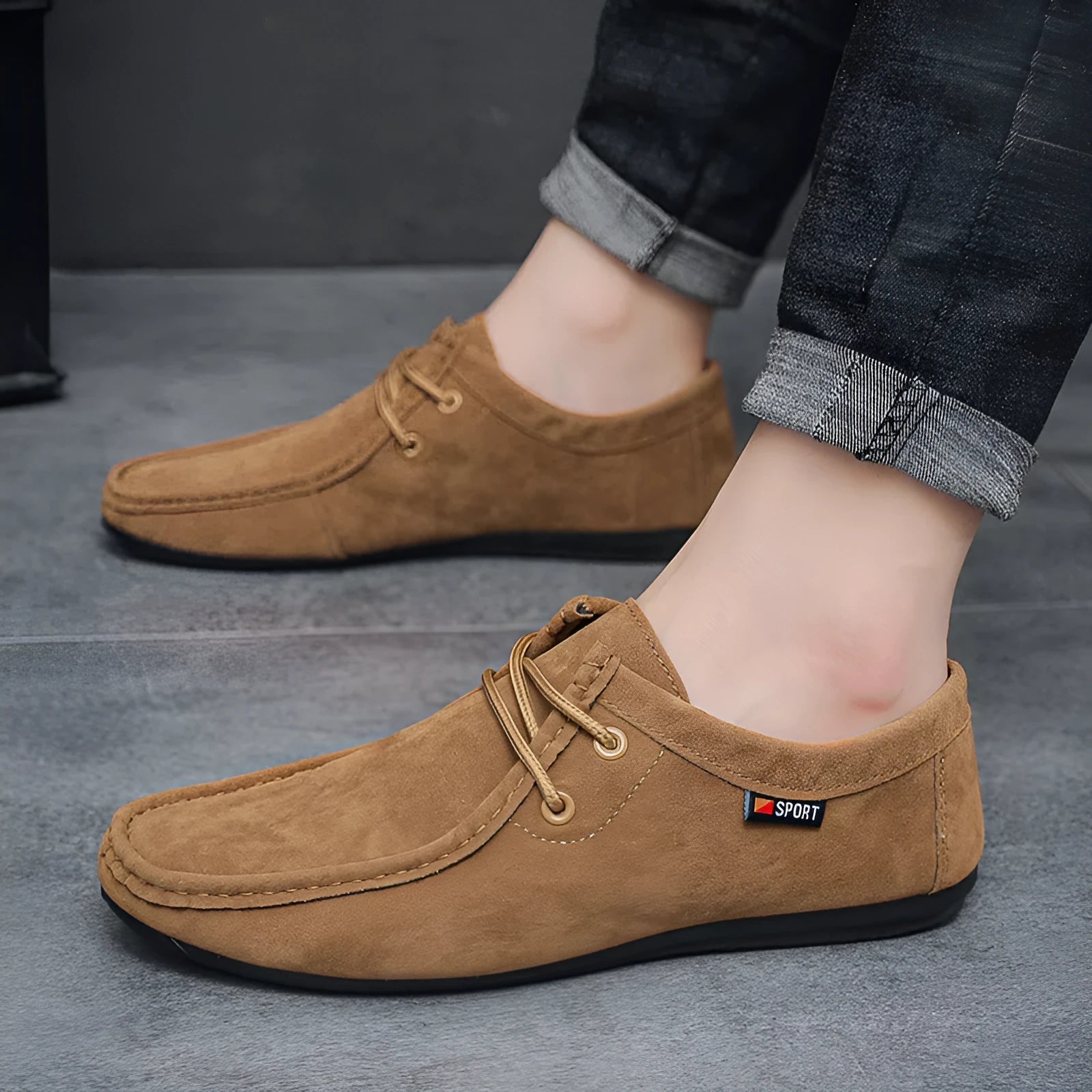 Men's black slip-on loafers with synthetic PU upper, stitched detailing, and non-slip plastic sole