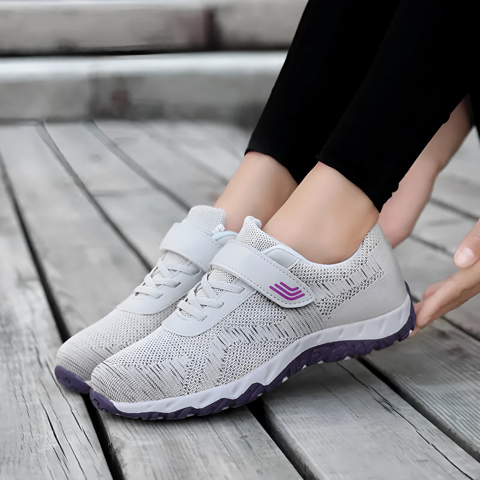 Women's grey purple low-top casual shoes with Velcro strap and wedge heel on a plain background.