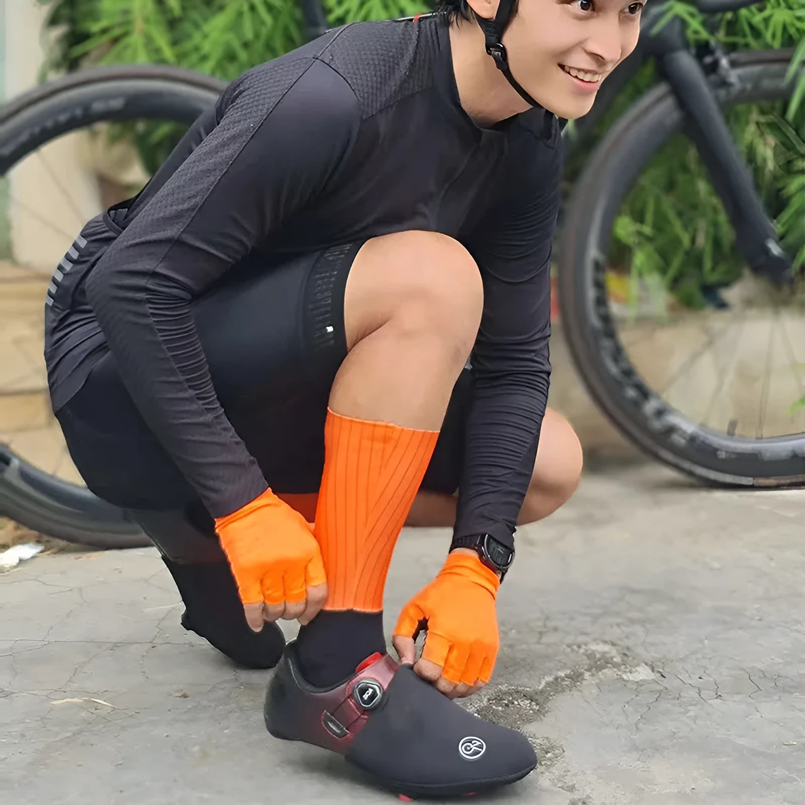 Cycling socks in chemical fibre blend fabric shown in orange, black, purple, white, grey and dark blue colour options