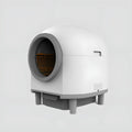 White automatic enclosed self-cleaning litter box for cats.