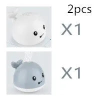 Automatic water-sensing whale bath toy with spray, lights, and music functions for baby bath time