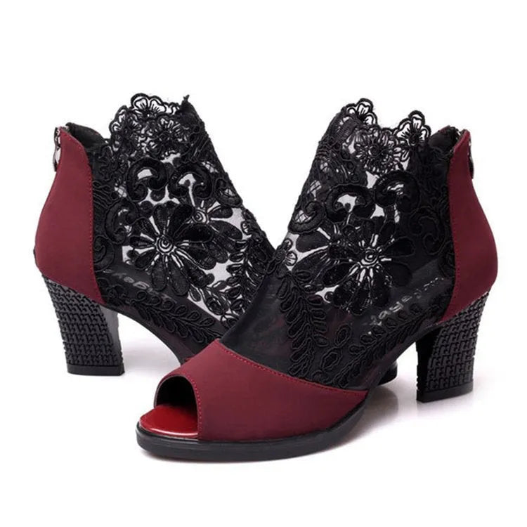 Women's black lace gladiator sandals with square high heel and zip closure, showing flower pattern detail