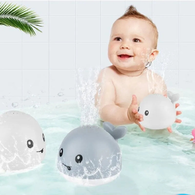 Automatic water-sensing whale bath toy with spray, lights, and music functions for baby bath time