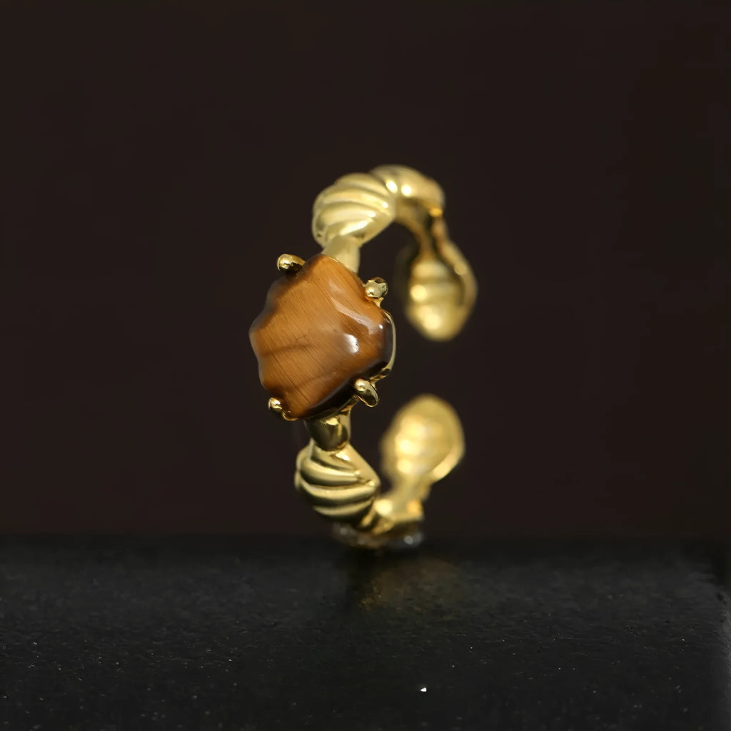 Adjustable sterling silver ring with shell elements and electroplated gold finish