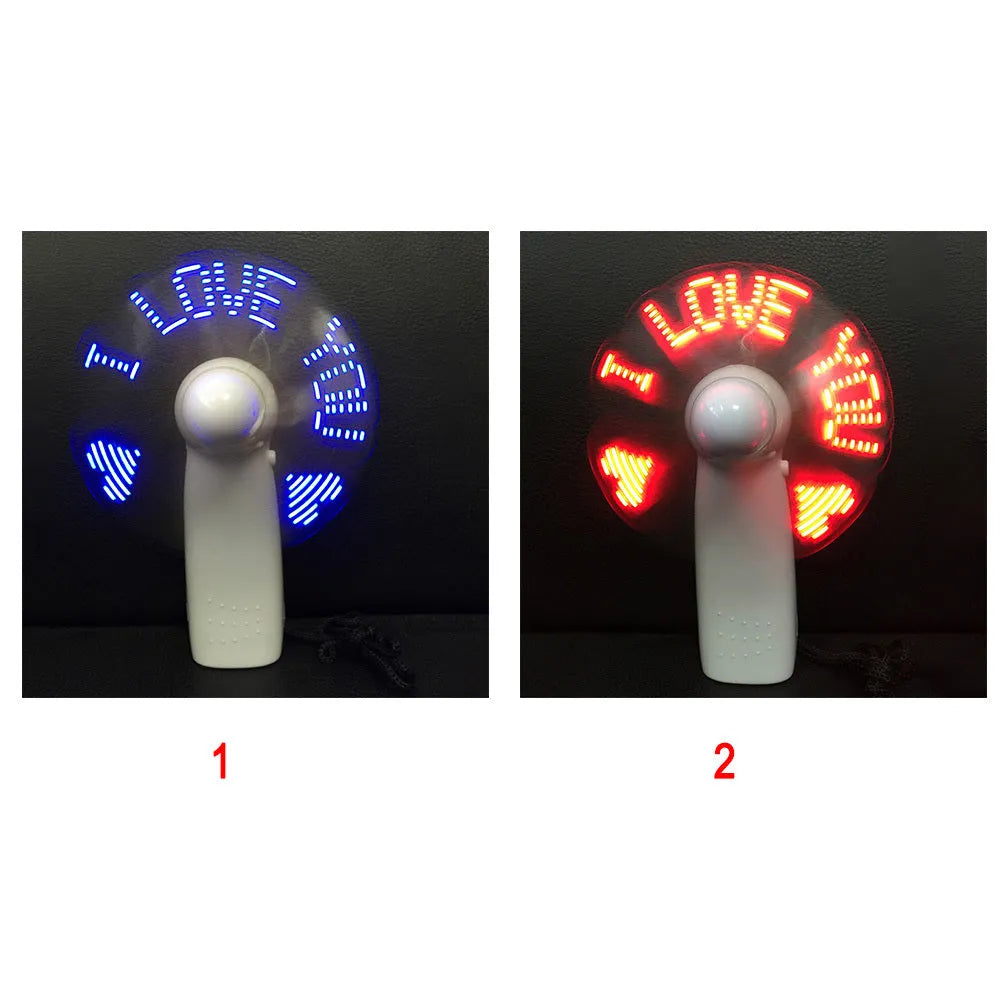 White handheld mini fan with a blue and red LED display showing 'I Love You' and a heart pattern.