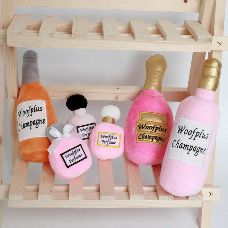 Plush wine bottle pet toy in assorted colours including green, orange, red, black and white.