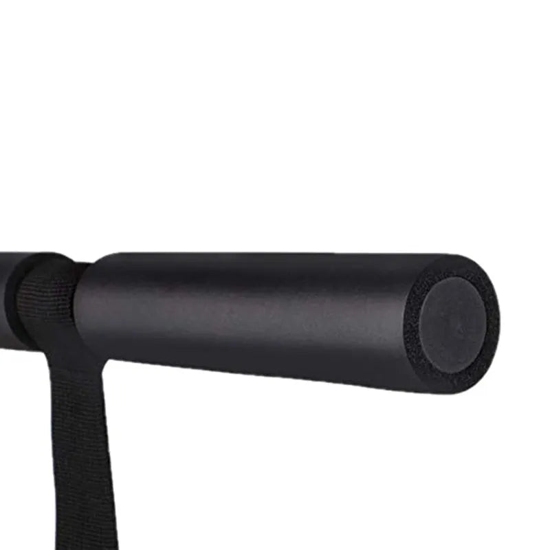 Black portable abdominal fitness device on a flat surface, showing steel frame with foam and PVC handles