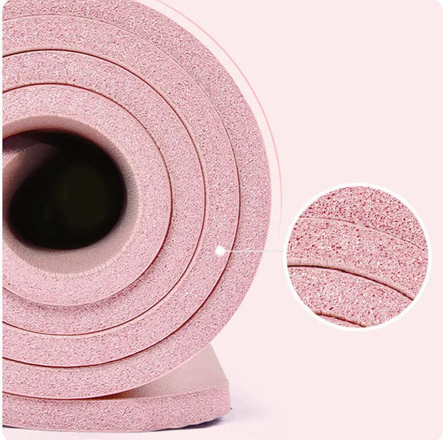 Widened blue TPE yoga mat 183x61cm on floor for home fitness stretching