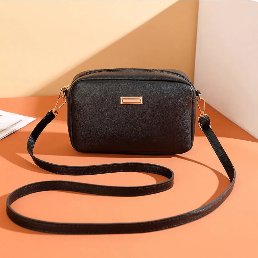 Solid colour PU women's shoulder bag showing three-dimensional pocket, in horizontal square shape.