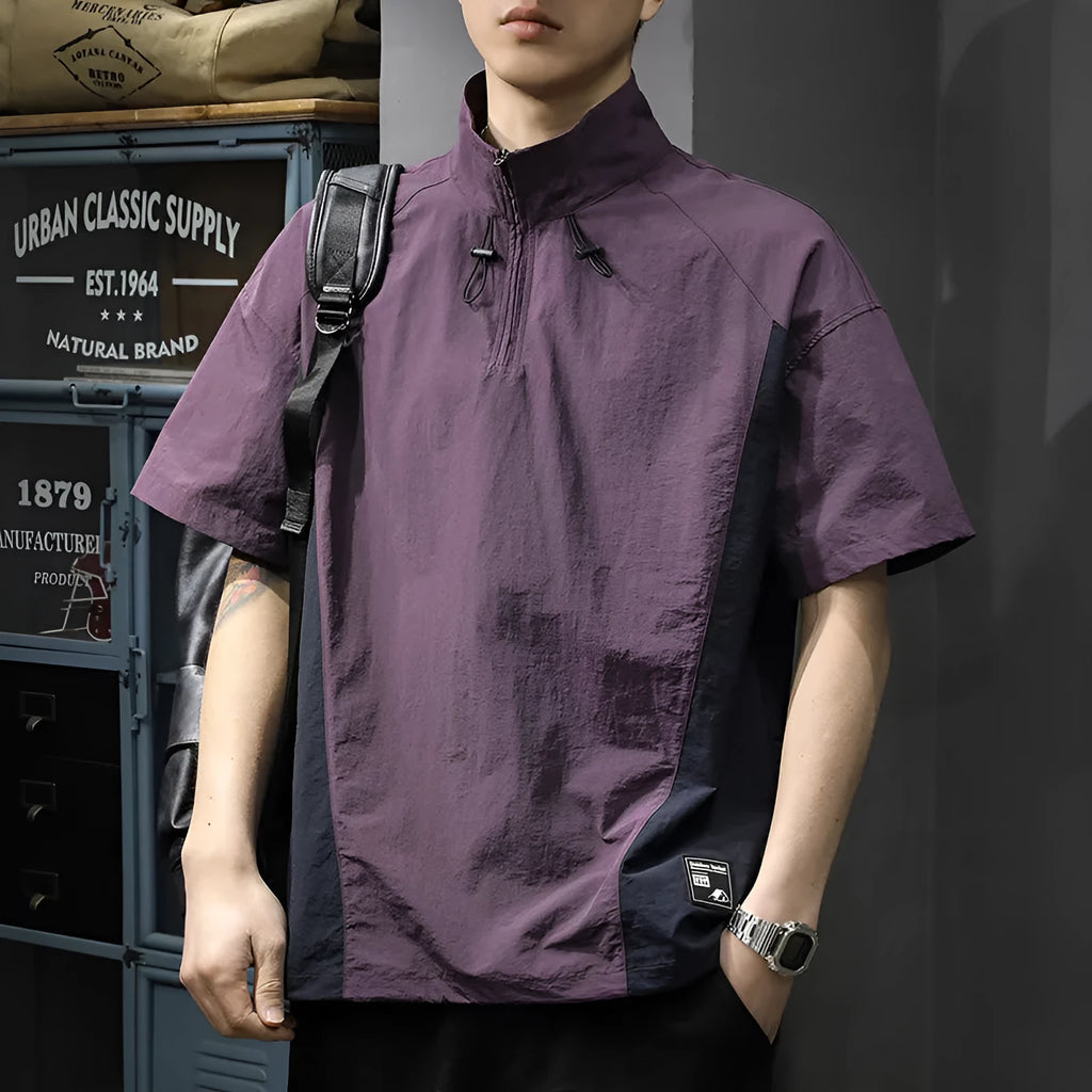 Brown men's casual half-zip short-sleeve shirt with a stand collar, showing the fleece-lined interior and loose fit.