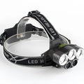 Fixed focus LED head torch with head strap, showing long-range beam for outdoor use.