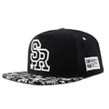 Cotton baseball cap with embroidered letters showing dome crown and adjustable back strap