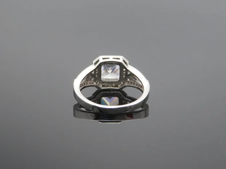 Women's geometric zircon ring with hollow design and platinum colour finish showing quadrilateral decorative elements